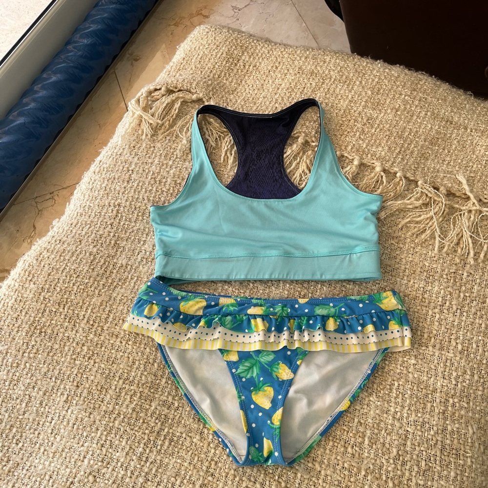 - - - - Two-piece swimsuit .Bottom with ruffles and fruits,